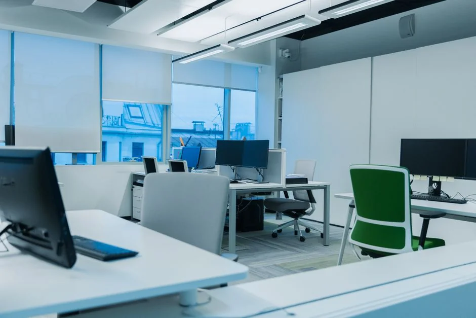 Prestations-01 individual-wearing-blue-long-sleeved-shirt-seated-next-to-black-laptop-9gpkrsbgmc